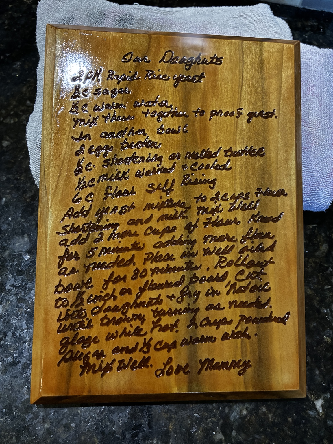 Handwritten recipe engraved on wood